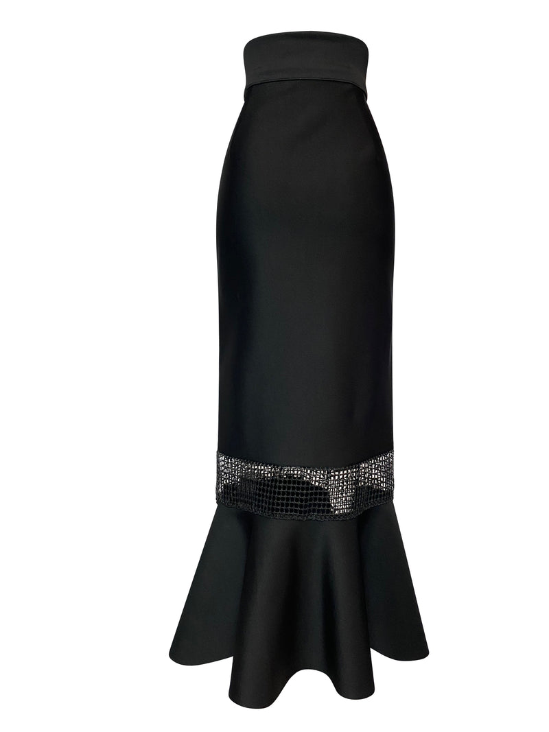 Back of black midi length skirt with sheer panels and fishtail